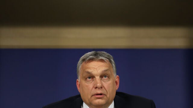 FILE -Hungarian Prime Minister Viktor Orban talks to journalists during a news conference following an European People's Party meeting at the European Parliament in Brussels, March 20, 2019. (AP Photo/Francisco Seco, File)