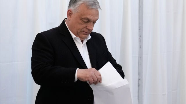 Hungary's Prime Minister Viktor Orban prepares to cast his ballot at a polling station in Budapest, Hungary, Sunday, April 12, 2026. (AP Photo/Petr David Josek)