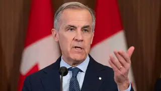 Canada Carney Prime Minister Mark Carney responds to a question following an announcement on Parliament Hill in Ottawa, Tuesday, April 14, 2026. (Adrian Wyld/The Canadian Press via AP)