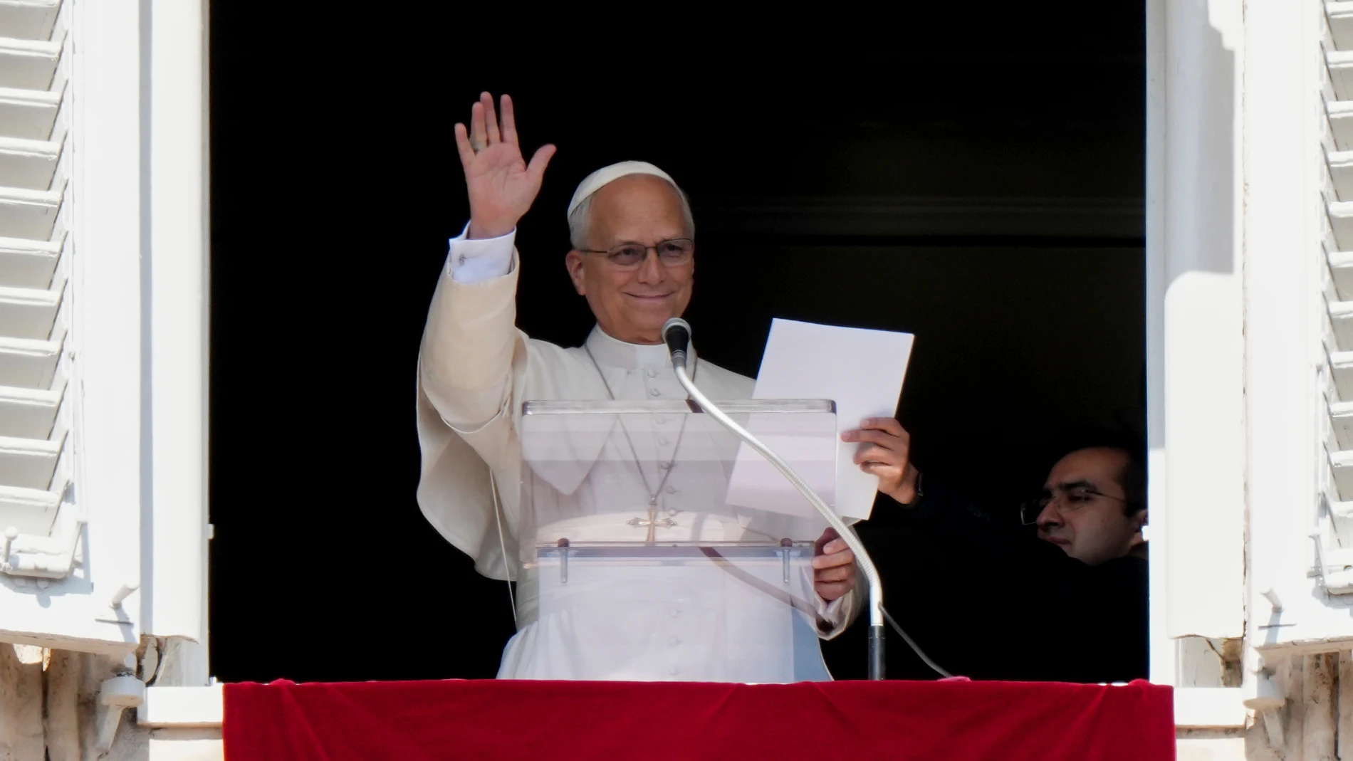 Pope Leo XIV gives his blessing while reciting the Angelus from the window of his study overlooking Saint Peter's Square at the Vatican, Sunday 4 October 2026.
